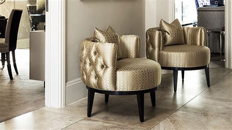 Armchair with modern sculptural metal frame. Occasional Chairs | Tub Chairs | The Sofa & Chair - London