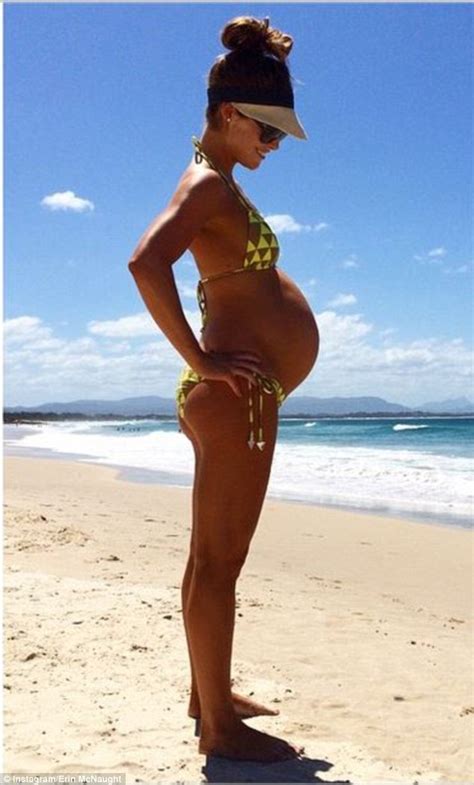 While pregnancy seems to agree with some people, it can be incredibly challenging for others. Erin McNaught shows perfect pregnancy body on beach with ...