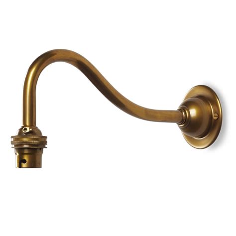 Ceiling fixtures can vary from chandeliers for a formal dining room, a new light and fan combination for a family room, or a new look in a recently remodeled room. Swan neck wall light fitting in antiqued brass | Wall ...