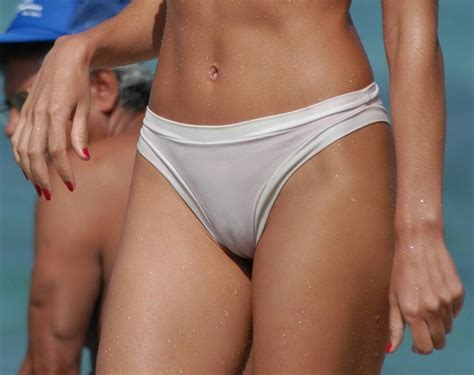 Clothing that has a single seam running through the crotch area is more prone to camel toe. White bikini bottoms are always a good choice! : cameltoe