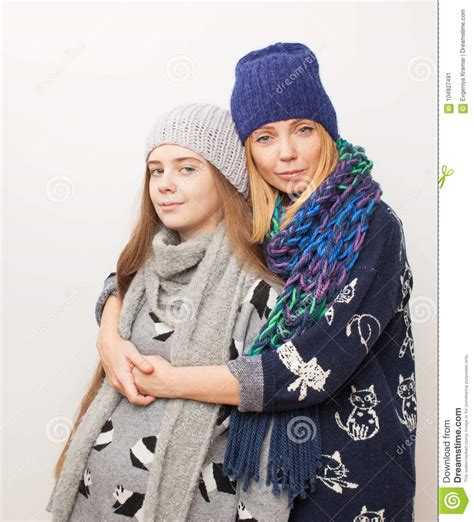 Mom milf seduces the handyman. Two Girls In Winter Clothes Hugging On White Background ...