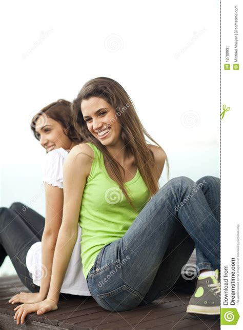 Three young happy women are having fun while riding on carousel. Two Young Women Having Fun Stock Image - Image: 12790631