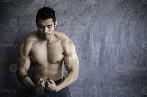 Portrait of asian man big muscle at the gym,Thailand people,Workout for