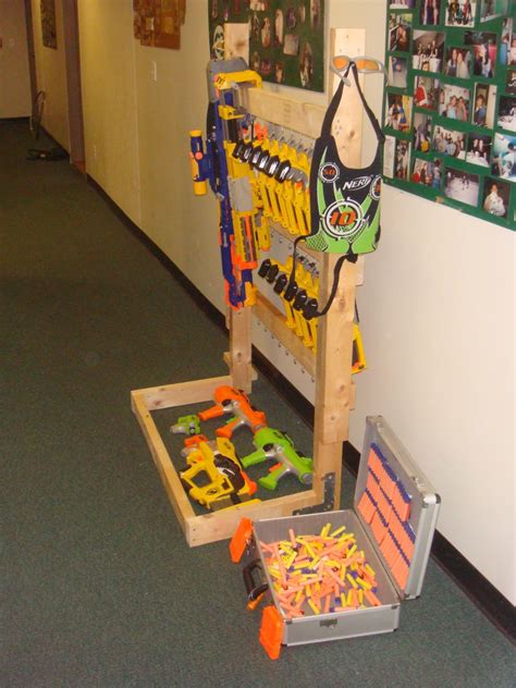 I put an over the door shoe rack on his door to put the nerf guns in! Pin on for the kids