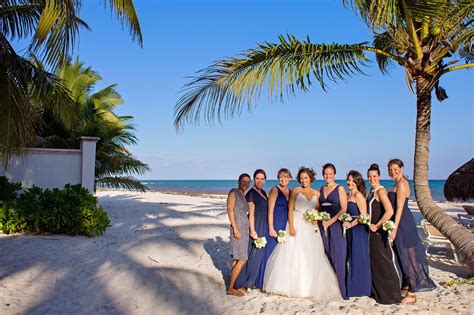 Beach weddings are becoming so common these days. Navy Bridesmaid Dresses at Beach Wedding