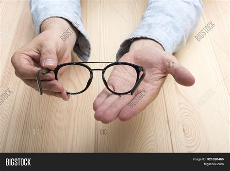 Maybe you would like to learn more about one of these? Glasses Hands. Men's Image & Photo (Free Trial) | Bigstock