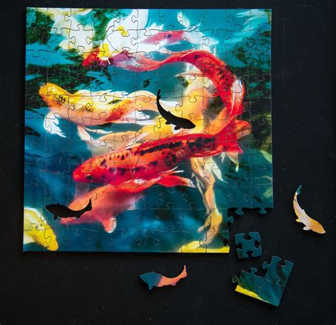 Qualified orders over $35 ship free. Koi Wooden Jigsaw Puzzle - Sawbridge Studios