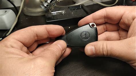 When changing a smart key pull the latch at the end of the key holder, stick your key horizontally into the open slot, and lift the battery compartment out to replace the batteries. Mercedes Benz Key fob replacement - YouTube