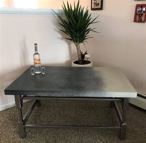 Using concrete to create garden decor initially, she grows rhubarb leaves and subsequently casts them into tables, waterfalls, and hanging fence decor. Coffee Table with Concrete Top and Polished Steel Base in ...