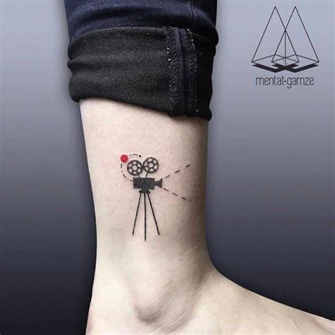 Small camera tattoos on wrist in 2019. Film camera tattoo on the ankle.