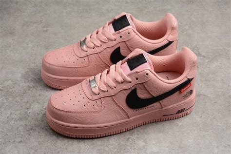 Nike's upcoming valentine's day 2021 collection just keeps getting bigger and better the nike air force 1s include tongues that can pop open and closed with buttons, reading: air force one nike noir et or
