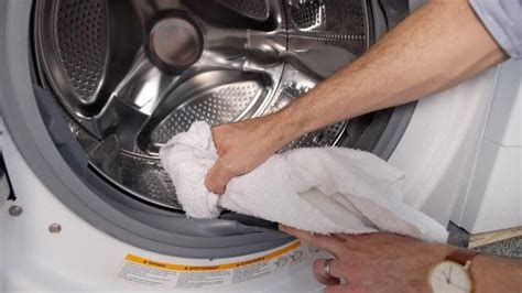 The rubber gasket at the front of the washer, especially in a. Why your washing machine smells—and how to clean it ...