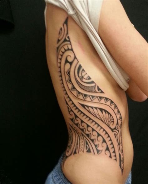 Sometimes, they proclaim one's beliefs and identity. 17 Awesome Tribal Rib Tattoos