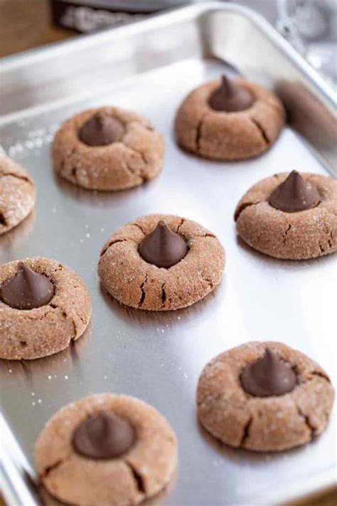 Peanut butter cookies topped with a chocolate candy piece are always a hit. Hershey's Kiss Cookies Recipe VIDEO - Dinner, then Dessert