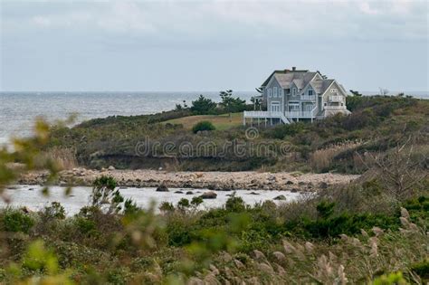 1 pack calamagrostis brachytricha syn. Small House Among Shrubs And Grass, Overlooking A Rocky ...