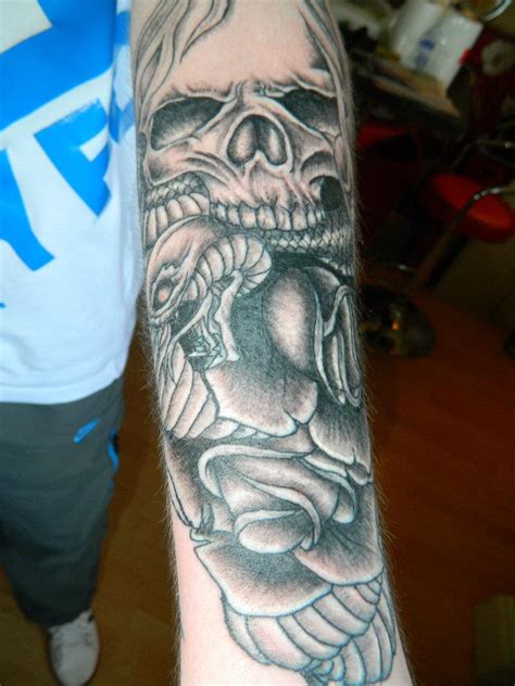 Planning on doing a full sleeve tattoo with all. skull and snake forearm tattoo by Craigwright on DeviantArt