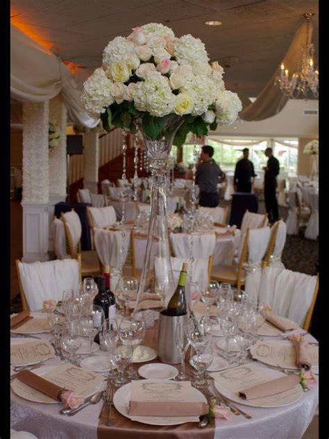 With same day flower delivery available before 3pm, who will you make happy? Tall centerpiece on a trumpet vase consisting of hydrangea ...