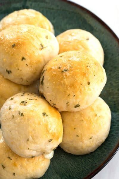 These cheesy stuffed garlic bombs are an easy and quick way to enjoy garlic knots but 1,000 times better! Garlic Cheese Bombs stuffed with mozzarella! | Kitchen Gidget