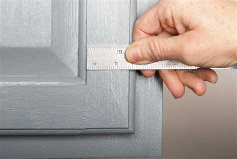 Place the corner cabinet into position on the wall stud marking. How to Install Cabinet Hardware