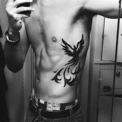 Rib tattoos for men come in a wide array of sizes and shapes. 40 Tribal Phoenix Tattoo Designs For Men - Mythology Ink Ideas