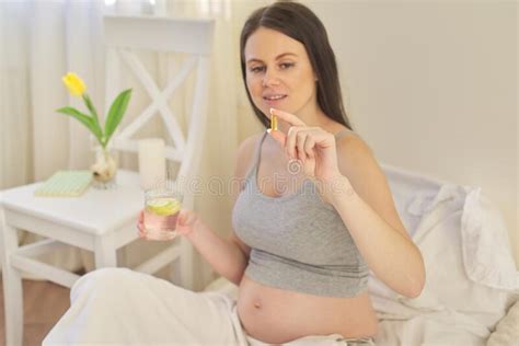 Learn which nutrients are key, and what to talk to your provider to make sure you get enough vitamin d, dha and iodine each day. Young Pregnant Woman Taking Vitamins. A, D, E, Omega-3 ...