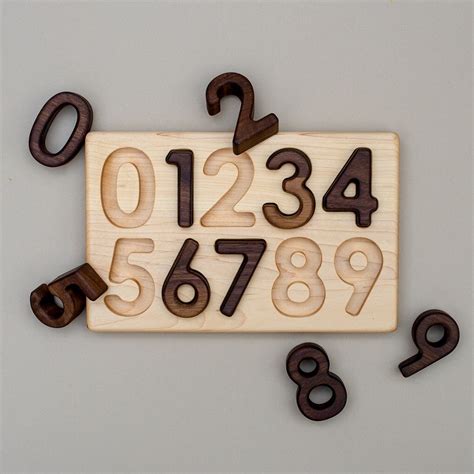 Wooden puzzles come in many forms and configurations. 0-9 Wooden Number Puzzle | Wooden numbers, Wooden, Maple wood