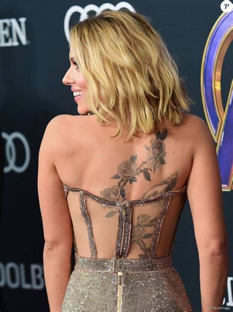 A bird in flight (l) and a rose (r).splash news. Ultimate Scarlett Johansson Tattoo Guide: All Tattoos ...