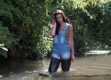 Nice girls in waders wet and muddy hübsche girls in waders naß und schlammig. Jumper and black waders in muddy water | Fishing waders, Waders, Womens rubber boots