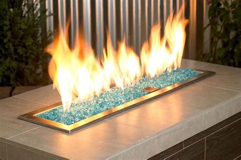 The basic elements that make up a fireplace are the damper, smoke chamber, smoke shelf, fire box (with fire bricks), lintel, throat, flue, roof line, flashing and cap. Logs and Burners - The Hearth Shop