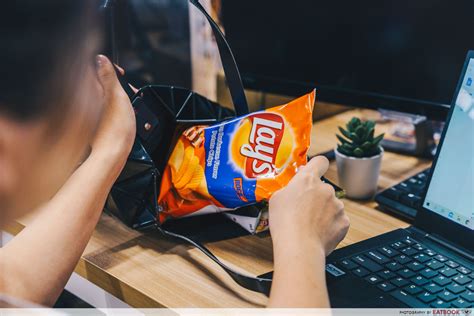 A customer picks packets of lay's potato chips at a shop in ahmedabad, india, april 26, 2019. Lay's Launches New Range Of Potato Chips Flavours In ...