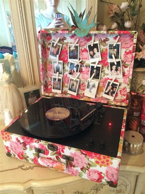 Maybe you would like to learn more about one of these? record player with polaroids (taylor swift record)😊