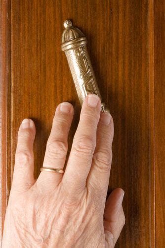 When it is a taller than average doorway, the mezuzah is still hung at shoulder level. How to Hang a Mezuzah - a traditional approach from My ...