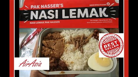 Packaging problem, the chicken thigh is too big and the paper was too small. AirAsia Malaysian Nasi Lemak Airline Meal by Pak Nasser ...