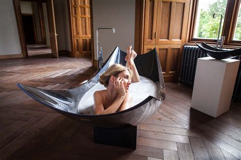 As every parent knows, bathing babies is a delicate affair. Free standing black carbon fiber hammock bath tub ...