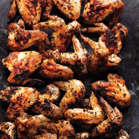 Breaded chicken wings that consist of bread crumbs, parmesan cheese, garlic powder, melted butter, and a cookie sheet. Herb Grilled Chicken Wings