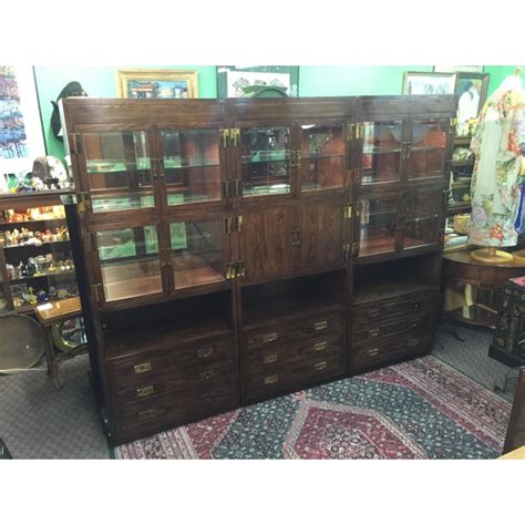 One spot on the dresser which is pictured appears to of been repaired. Henredon Scene One Campaign Cabinet Wall Unit | Chairish