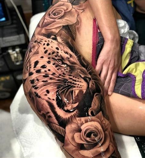 Black rose tattoo on thigh looking very cute. Lion, Realistic, Rose Tattoo on Leg, Rib Cage, Thigh ...