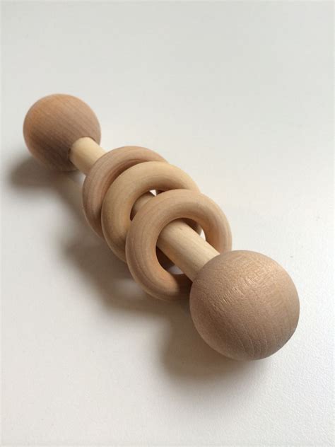A montessori toy is a toy that supports the same educational philosophy created by dr. DIY Montessori Grasping Rattle | Montessori, Montessori ...