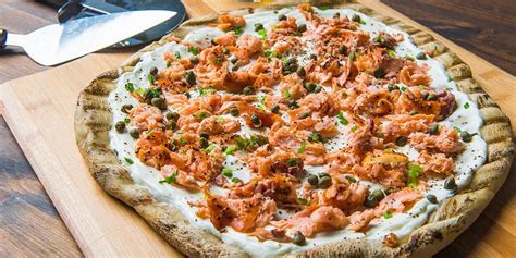 A healthy and easy flatbread that only takes a few minutes to make and is perfect for breakfast, lunch, brunch, or as a snack or appetizer. Smoked Salmon Flatbread | Traeger Grills