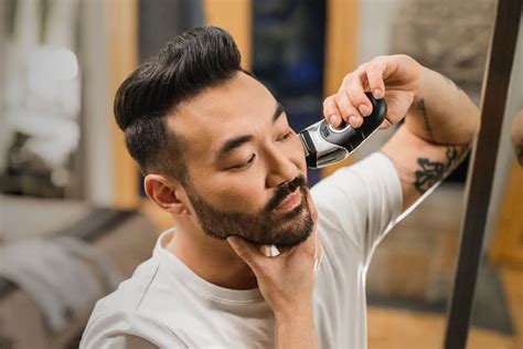 Mendoza recommends always using a beard trimmer with adjustable length guards to make it easy to adjust the length evenly. How To Maintain Short Facial Hair Using A Beard Trimmer