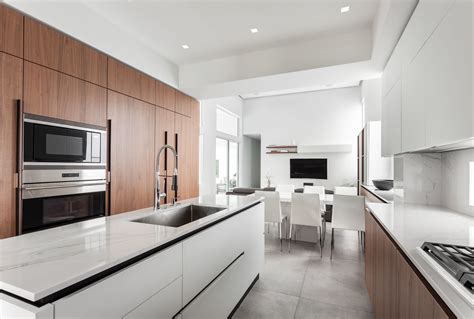 With custom hardware, matte and sleek glass finishes, caf offers distinct appliances to match your style and tastes. Modern, elegant kitchen by Mia Appliances with Sub-Zero ...
