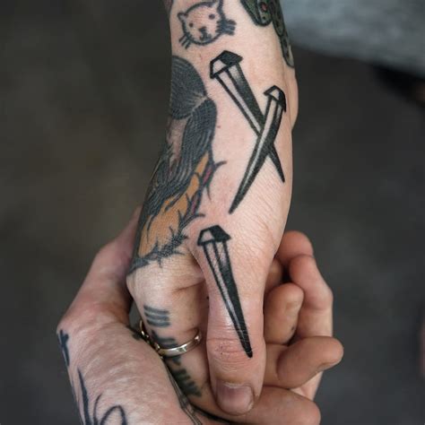 I've seen this motif used as a filler regularly. 15 Brutal Nail Tattoos | Tattoodo