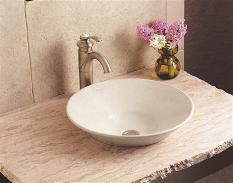 Platinum and gold accents add a refined sense of luxury to this conical bell vessel sink. Velvet & Linen: lighting