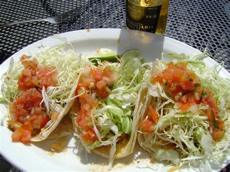 Alaska flounder with lightly seasoned breading on a corn tortilla with melted cheese, citrus slaw and cilantro. WAHOO'S FISH TACOS, Laguna Beach - 1133 S. Pacific Coast ...