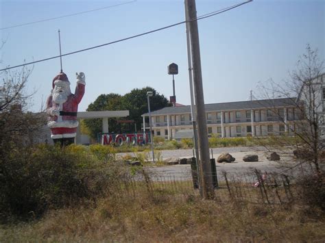 In as little as five minutes, you'll find several more restaurants just a short drive away from town. abandoned motel sign and giant santa in santa claus ...