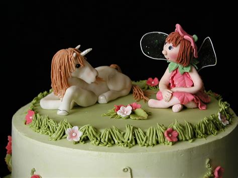 Unicorns have long been our fantasy creatures of choice, and while it may seem the mythical beasts were everywhere last year, they continue to trend. topper for fairy unicorn cake | closeup of the fairy and ...
