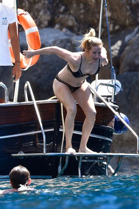 Moving here has made me. ELLIE GOULDING in Bikini at a Boat in Capri 07/04/2017 ...