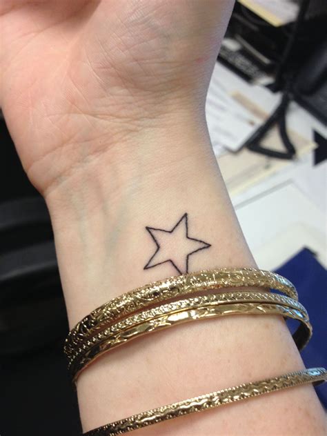 A simple, small and cute star can inked. Right wrist star tattoo | Star tattoos, Simple wrist ...