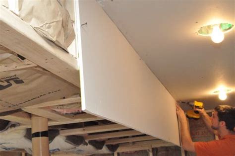 On the outside of the drywall, measure and mark where the sheet will contact the studs. How to Install Drywall (with 75+ pics): Hanging, Taping ...