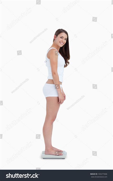 Understanding women body types will help you lose weight. Side View Of A Woman Standing On Weighing Scales While ...